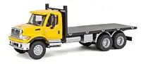 WALTHERS HO International(R) 7600 3-Axle Flatbed Truck - Assembled -- Yellow Cab, Black Flatbed